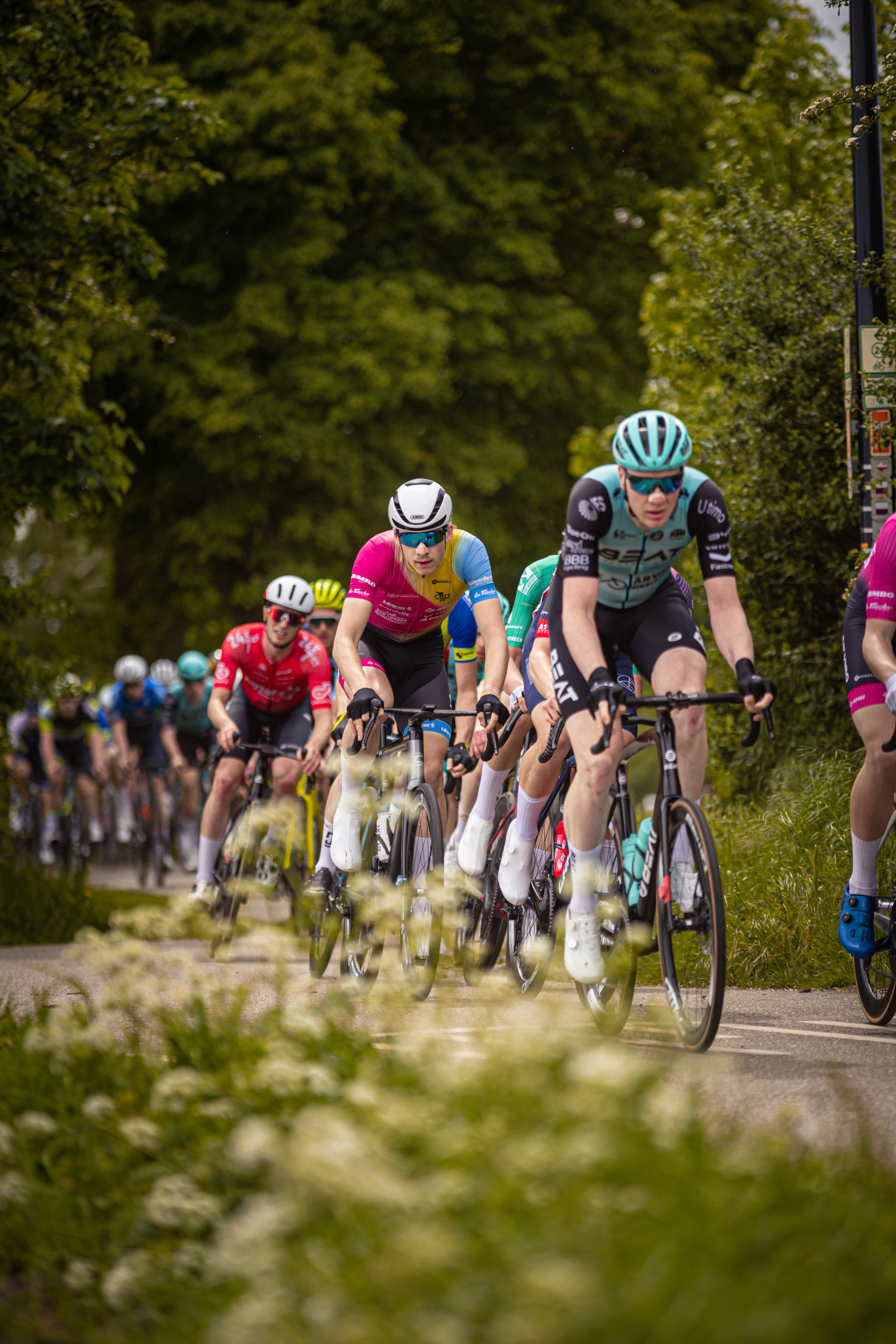 A group of cyclists are participating in the Ronde van Overijssel race.