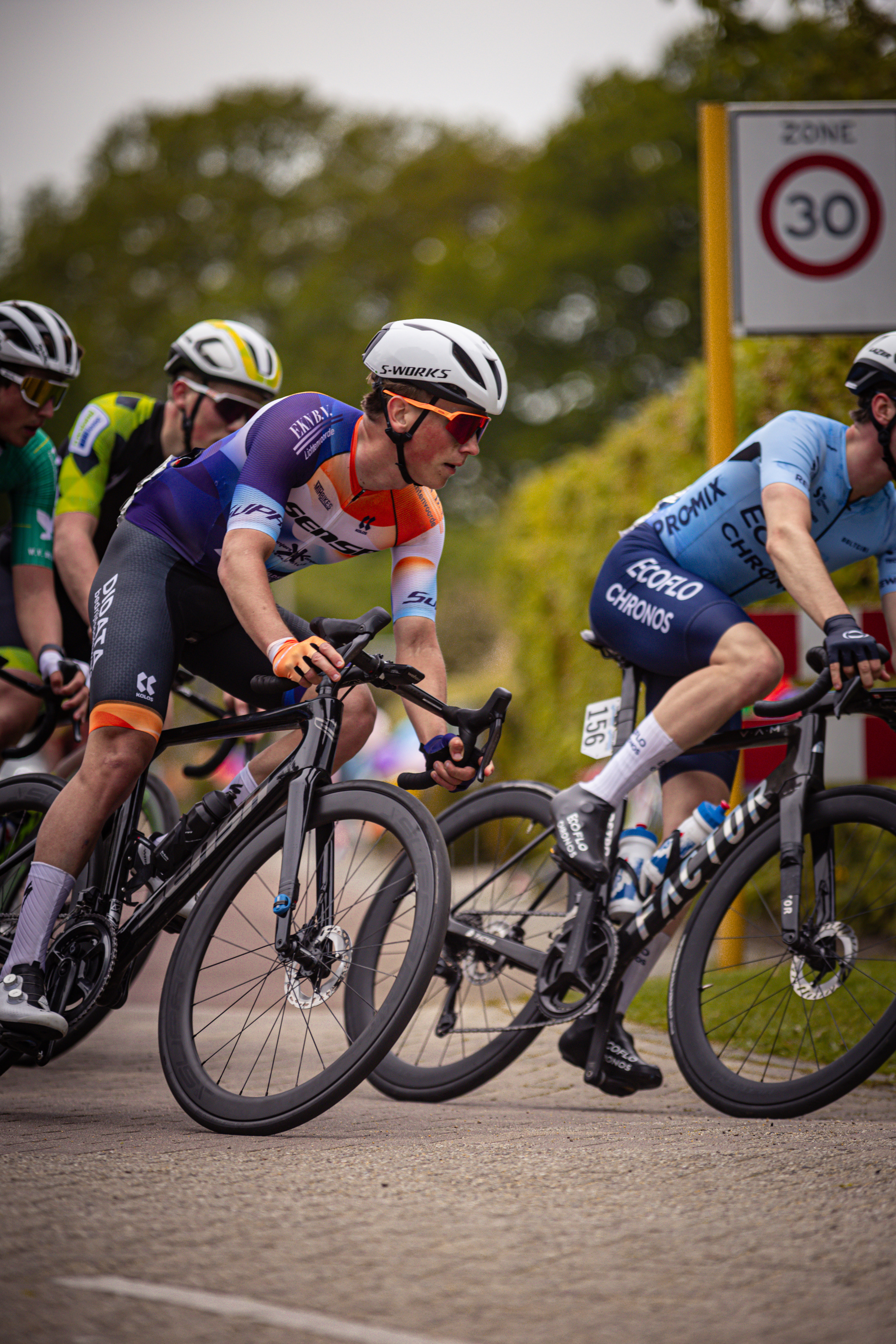 A group of cyclists compete in a bicycle race held by the Ronde Van Overijssel.