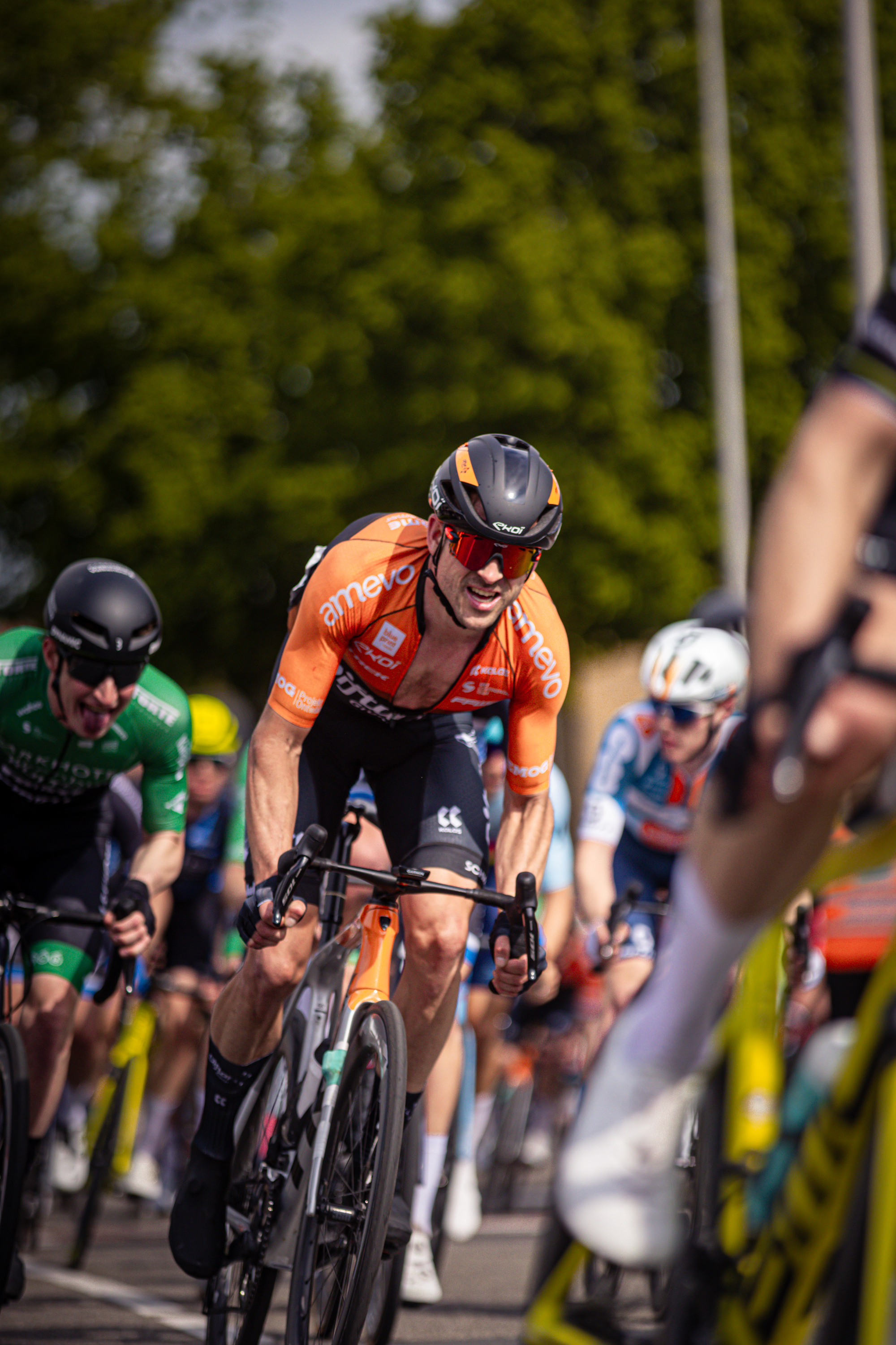 The cyclists are competing in a bike race during the Ronde van Overijssel event.