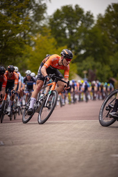 A cyclist is riding on a cobblestone street during the Ronde van Overijssel race.