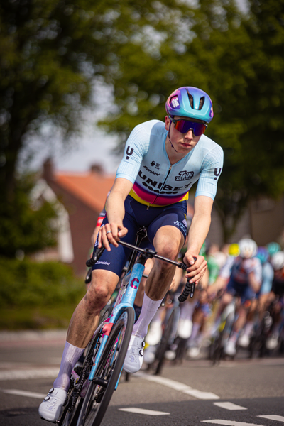 A cyclist with the number 1 is riding a blue bike at Rode van Overijssel in the Netherlands.