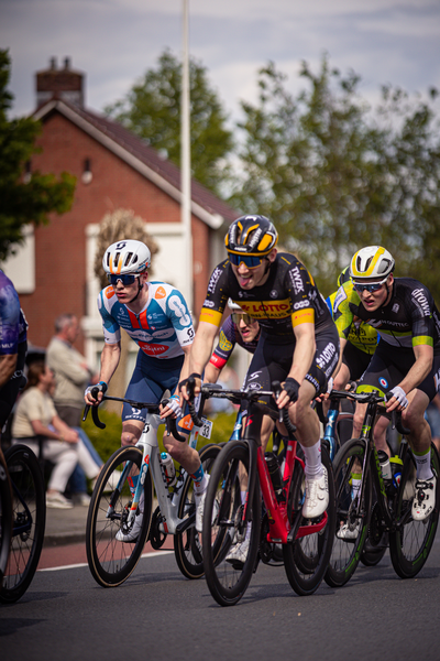 A group of professional cyclists competing in the Ronde van Overijssel race.