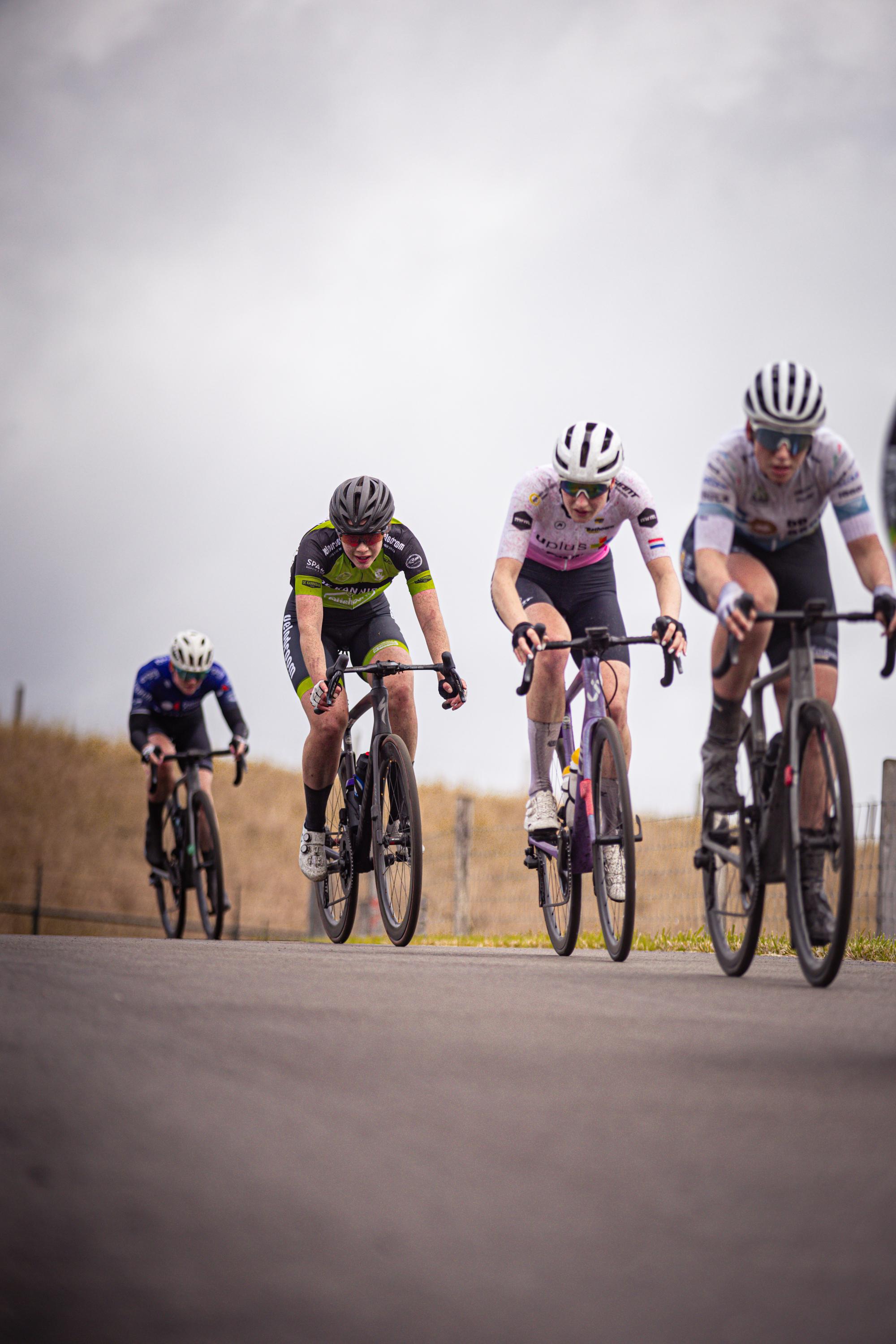 A group of cyclists participating in the Nederlands Kampioenschap.