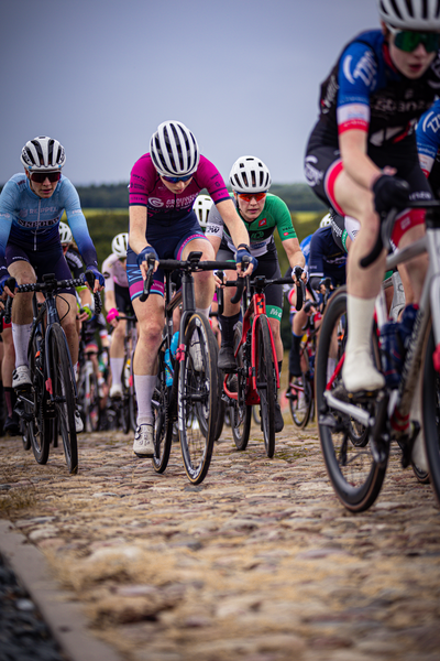 Several cyclists compete in a race sponsored by ZC.