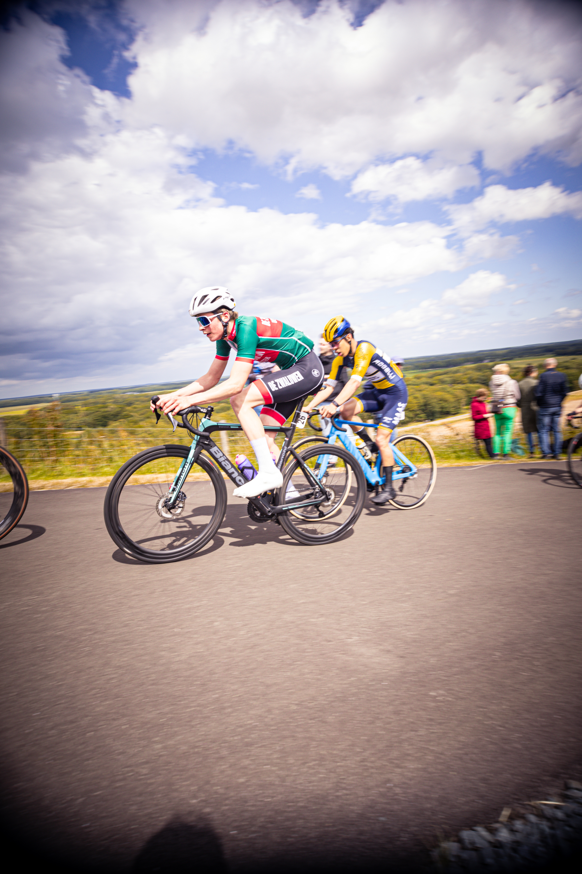 Two cyclists are riding a mountain bike race in Netherlands.