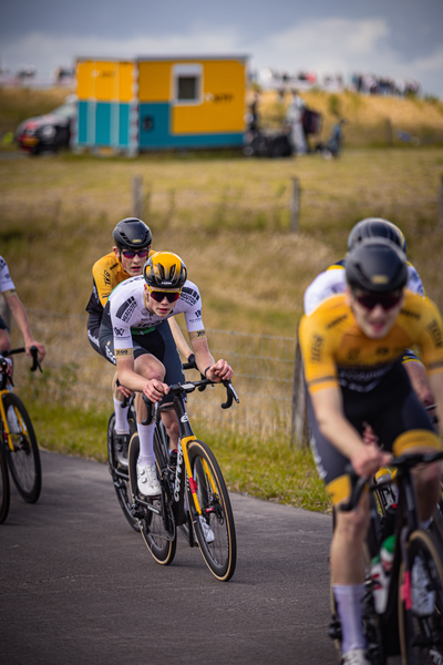 A group of cyclists are in a race and the cyclist in the lead has on number 1.