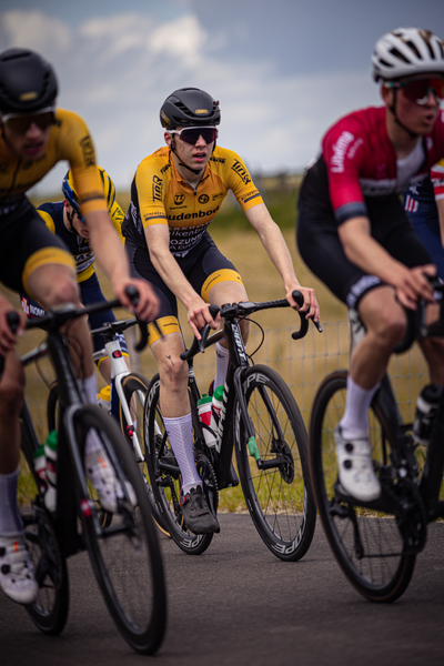 "Group of cyclists racing in the Nederlands Kampioenschap. 2024, Wielrennen, Junioren Mannen".