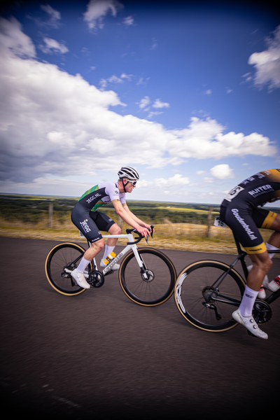 Two cyclists racing in the Netherland's 2024 championship of Cycling Juniors for Men.