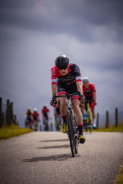 A group of cyclists participating in the Nederlands Kampioenschap.