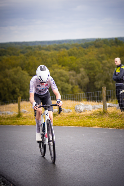 A person rides a bike in the Nederlands Kampioenschap Wielrennen event.