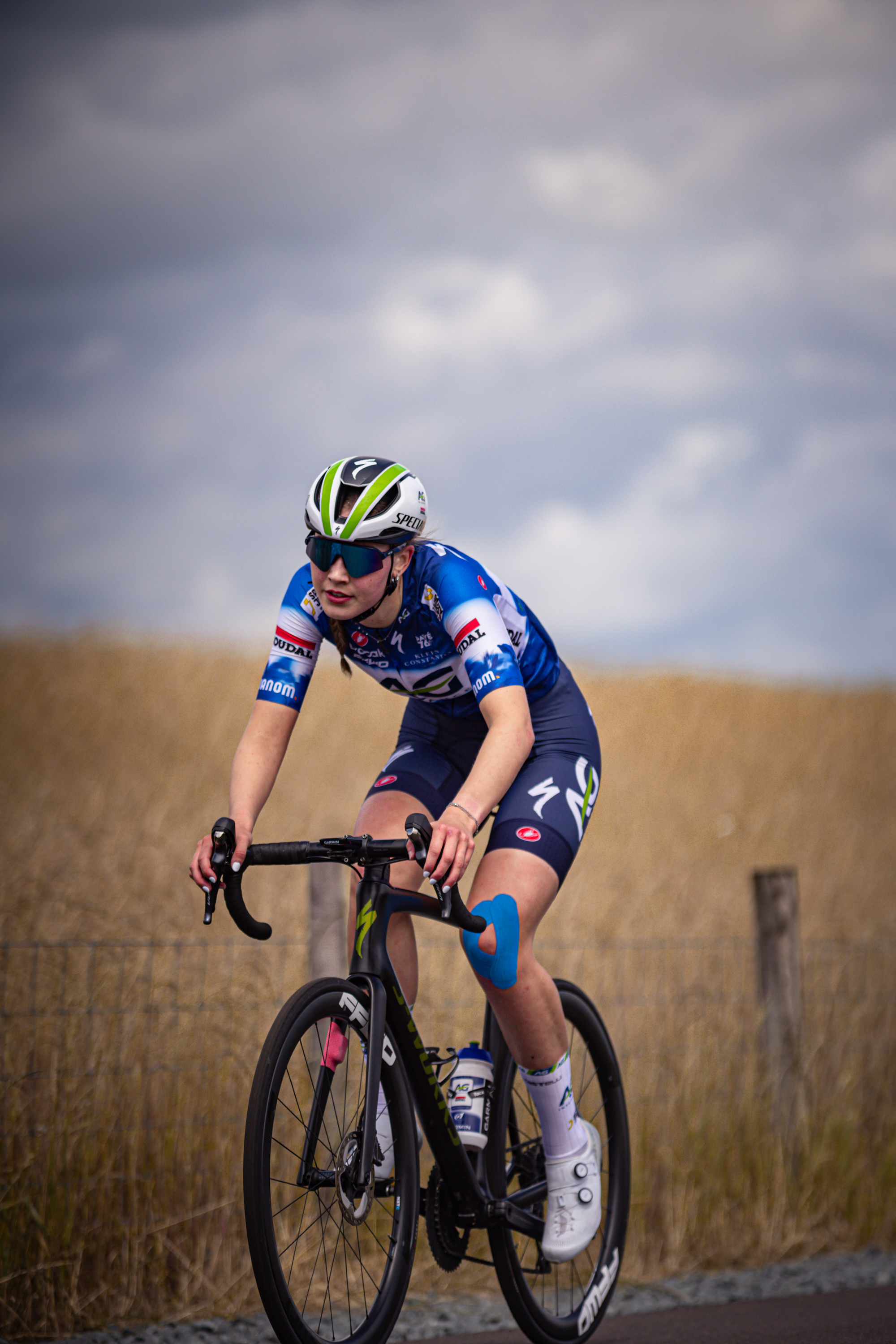 "A young woman on a bicycle at the Nederlands Kampioenschap for Junoren Dames in 2024".