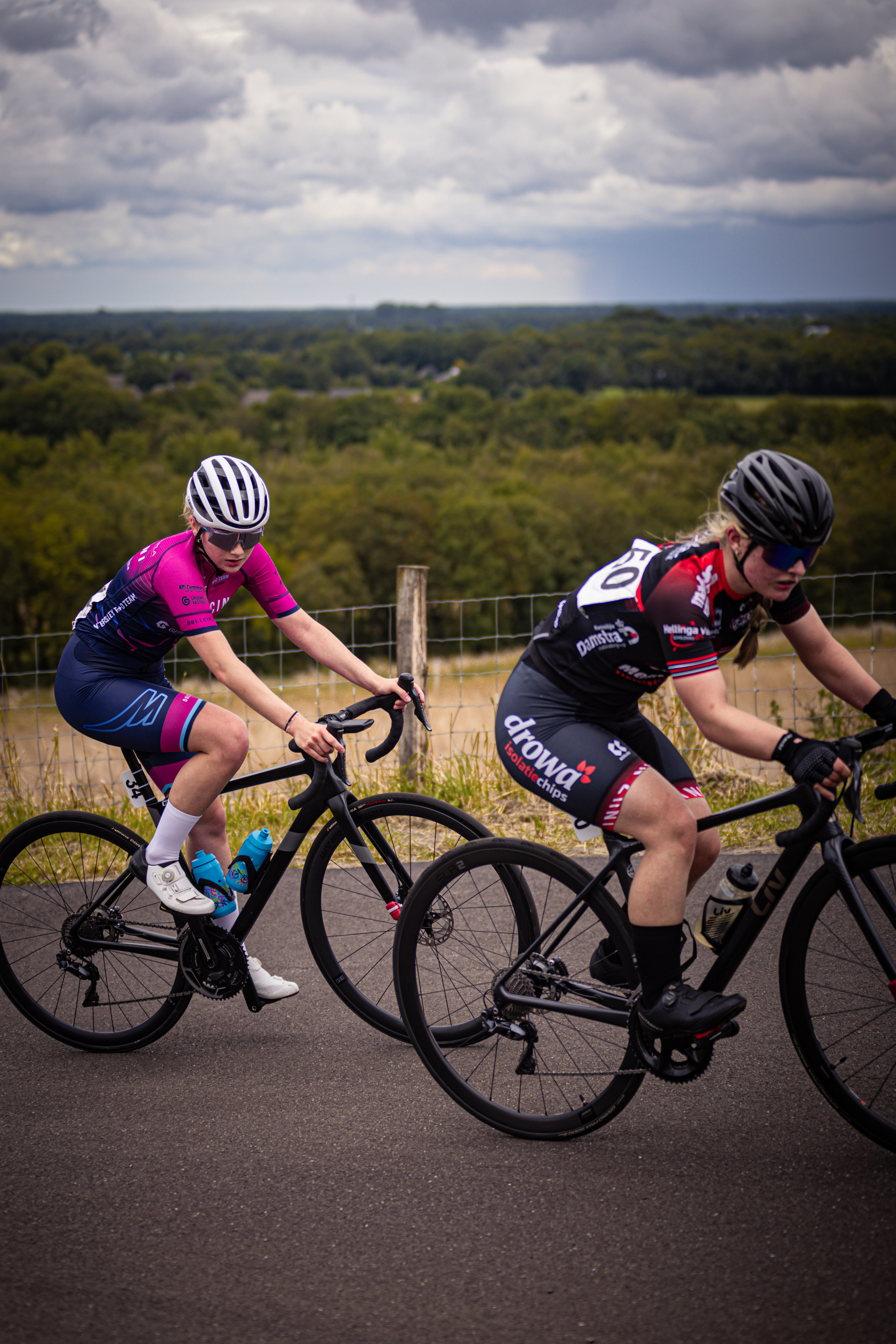 Two cyclists race in the Nederlands Kampioenschap.