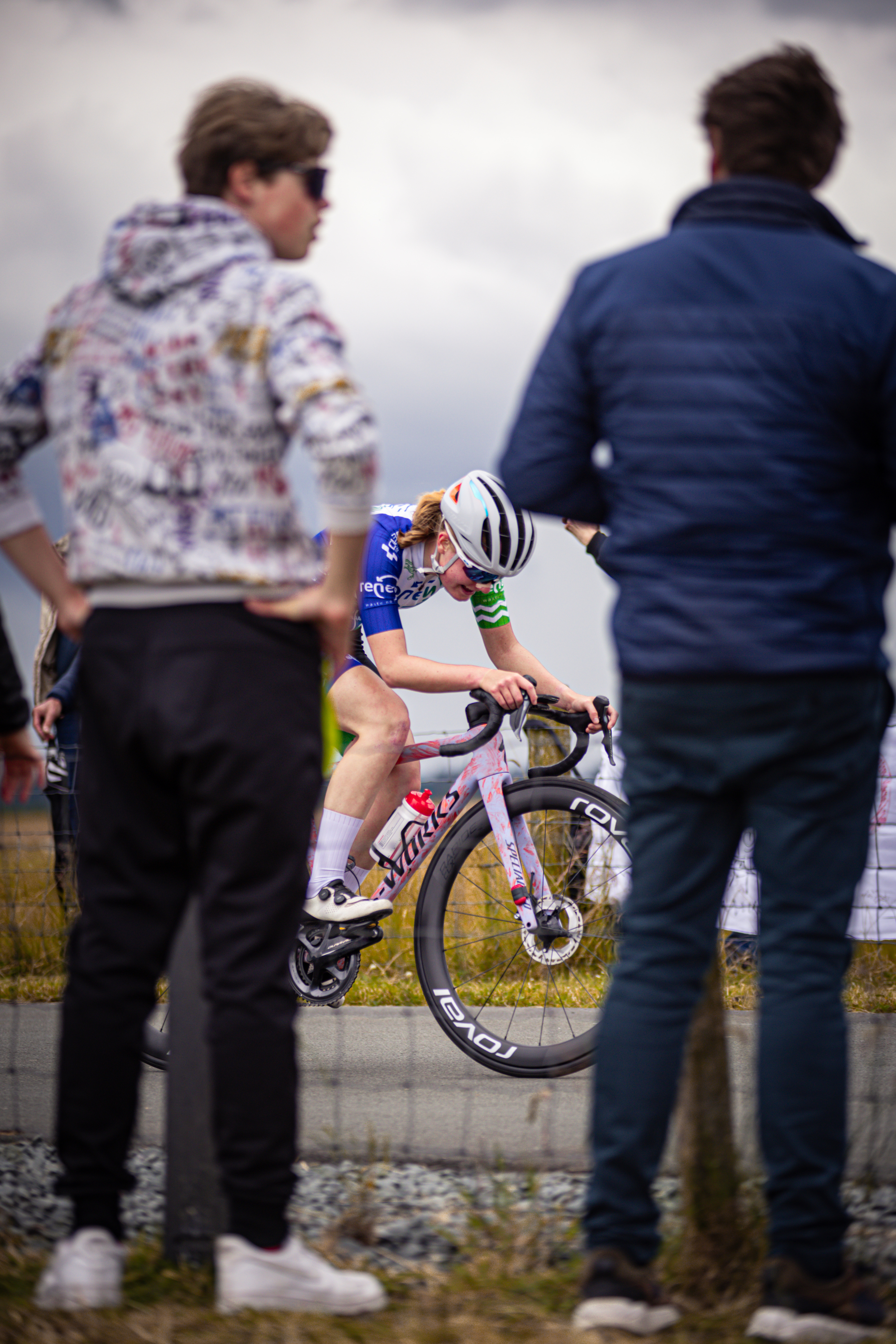 A young woman on a racing bike with the number 1 is being sponsored by a Dutch company.