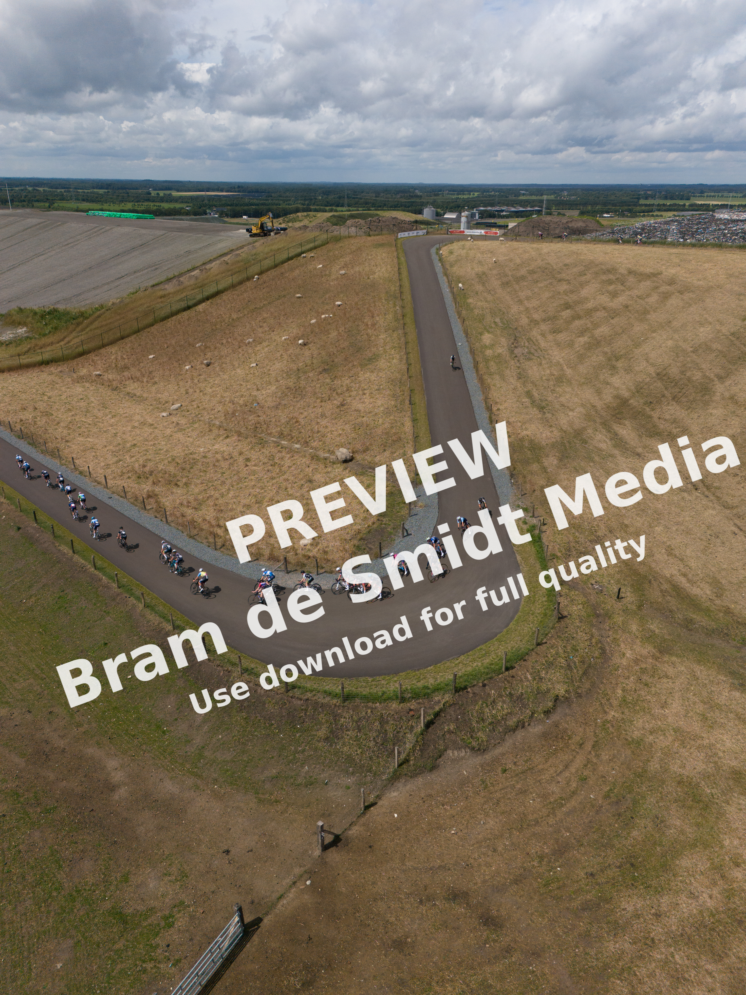 "Junioren Dames compete in a race around the bend on this day at Nederlands Kampioenschap 2024."