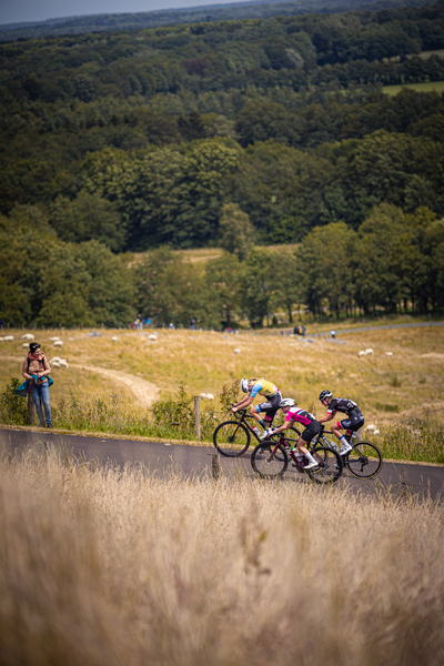 A group of cyclists race up a hill during the Nederlands Kampioenschap.