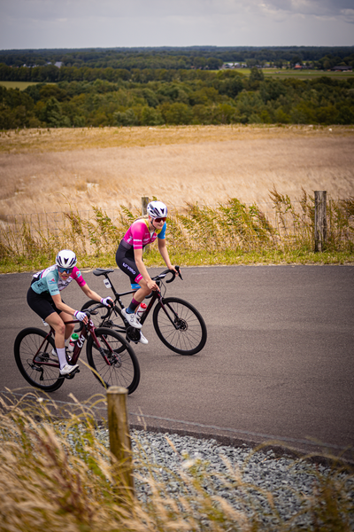 Three cyclists, a group of women racing in the Netherlands.