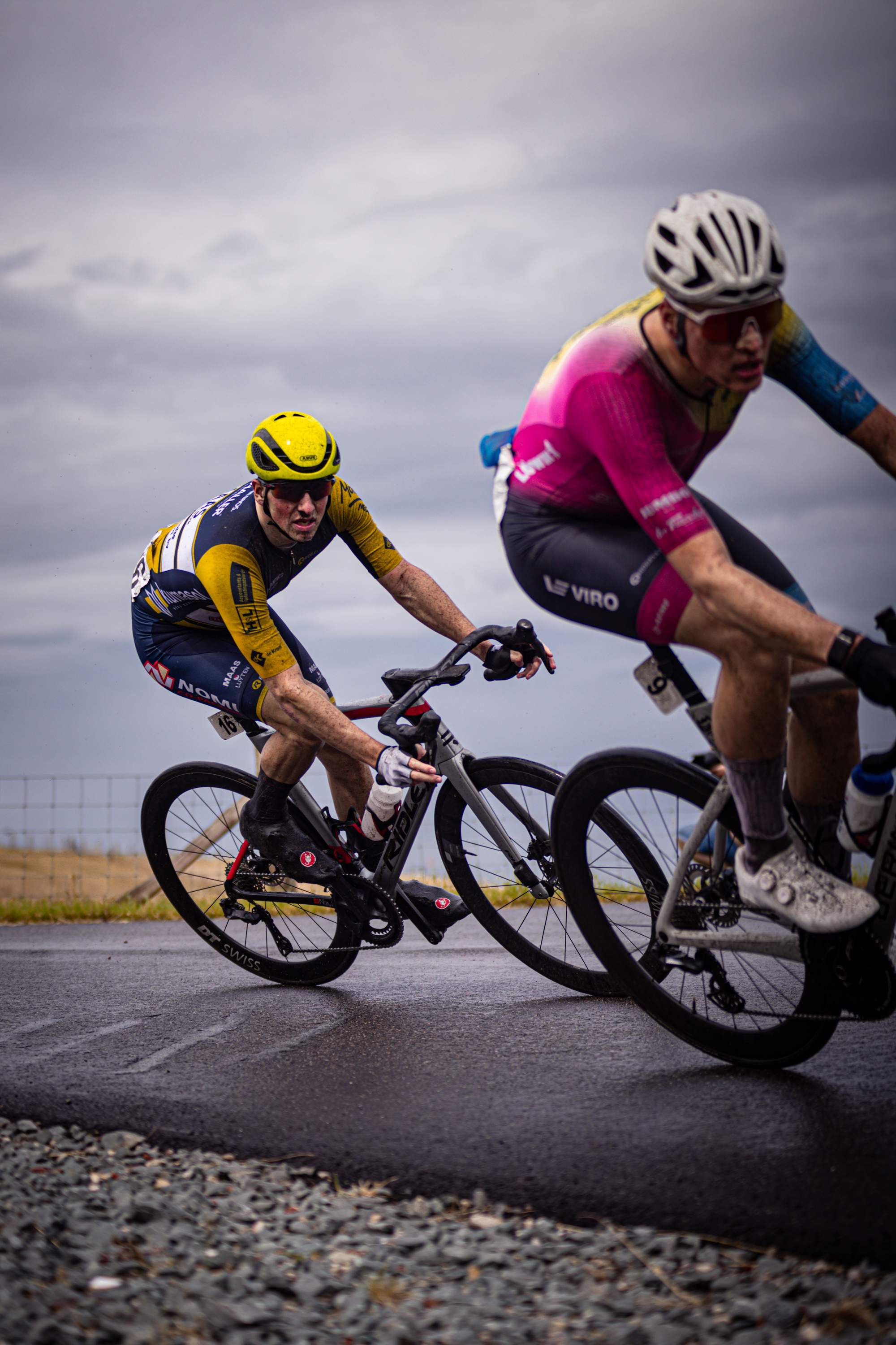 Two cyclists compete in the Nederlands Kampioenschap.