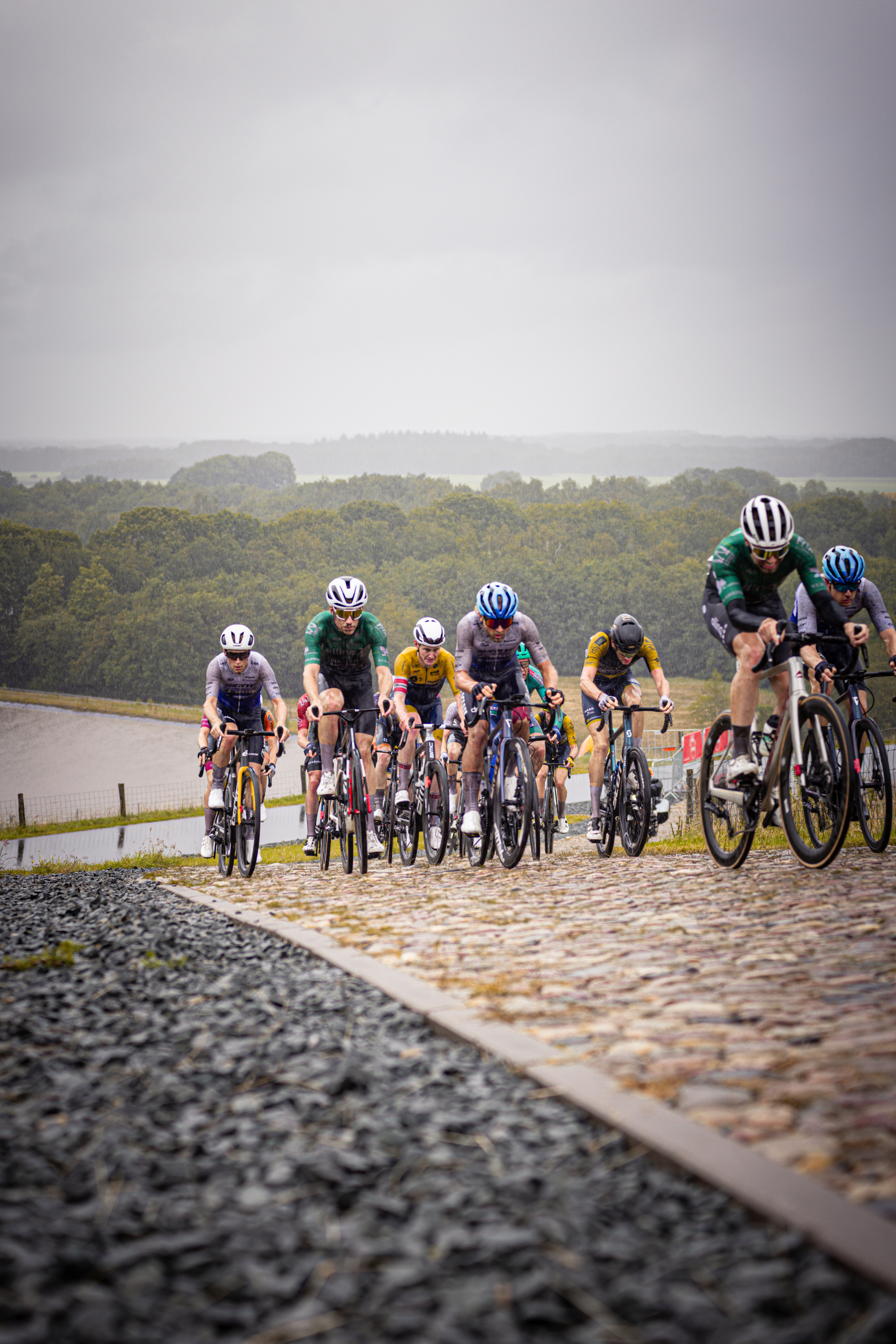 A group of cyclists in a race with one cyclist ahead.