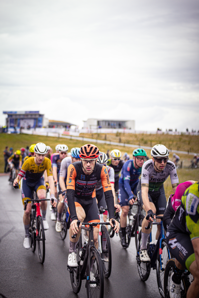 A group of men race on their bikes during the Nederlands Kampioenschap.