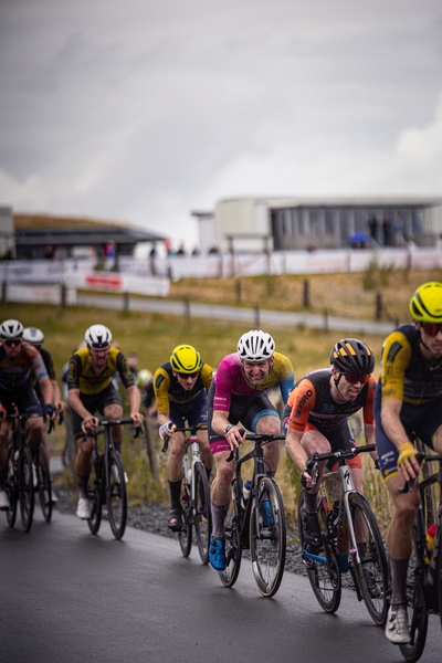 A group of cyclists participating in the Nederlands Kampioenschap.