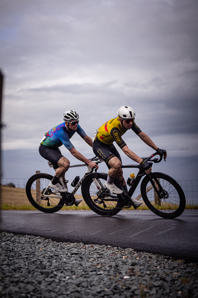 Two men are riding on their bikes in a race for the Netherlands Championship.