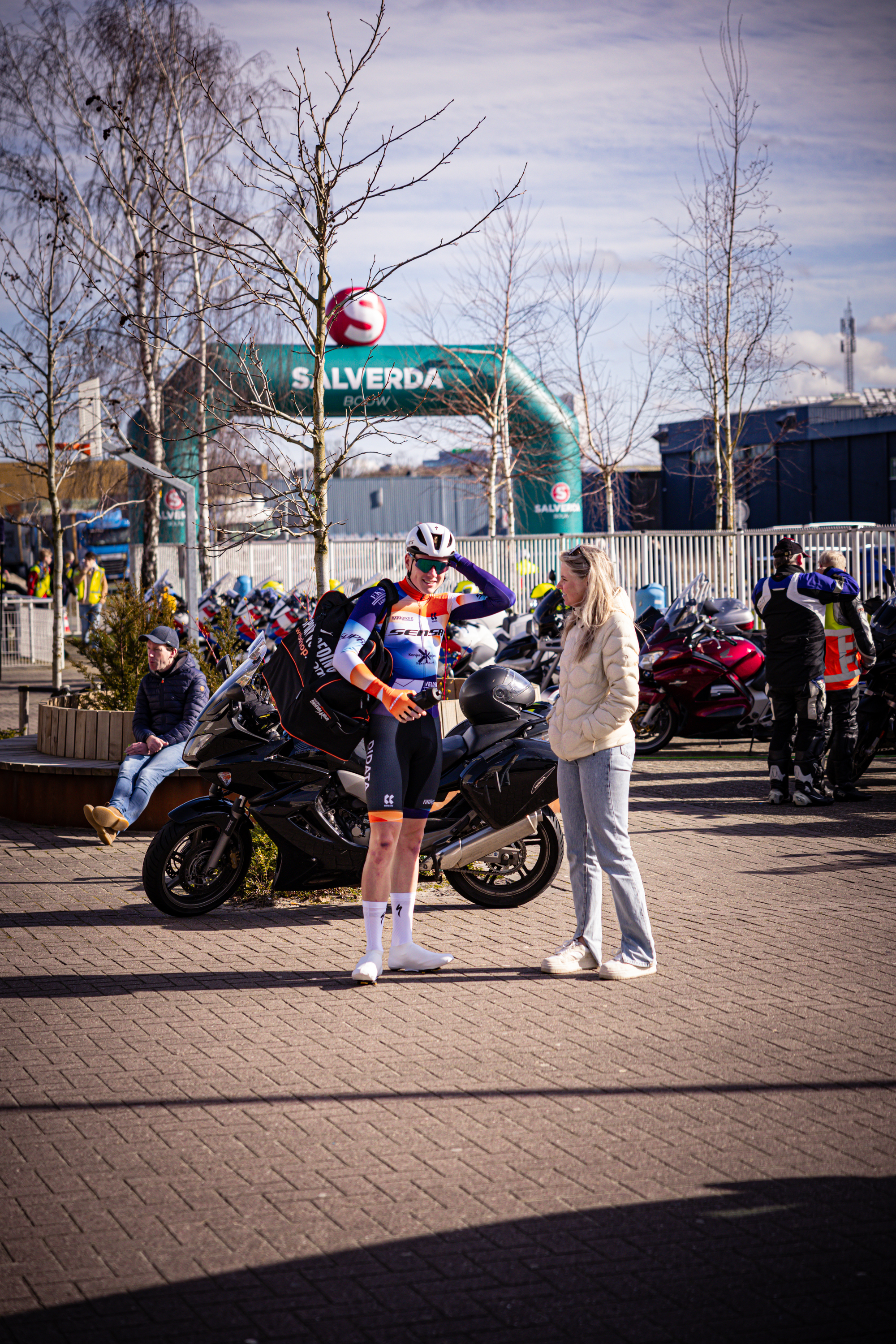 Two cyclists are wearing blue and orange jerseys at a Ster van Zwolle race.