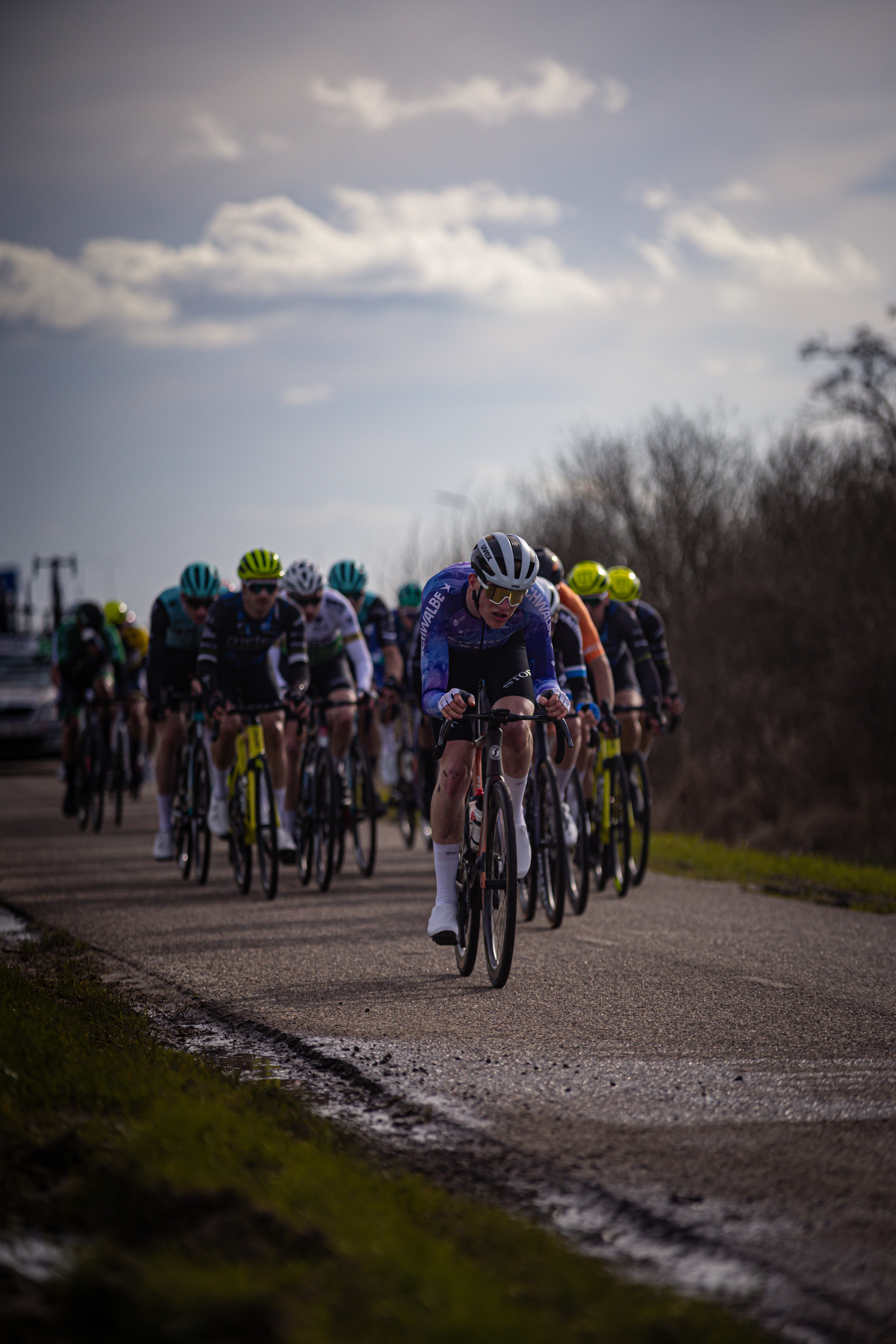 A group of cyclists race together in a Ster van Zwolle event.