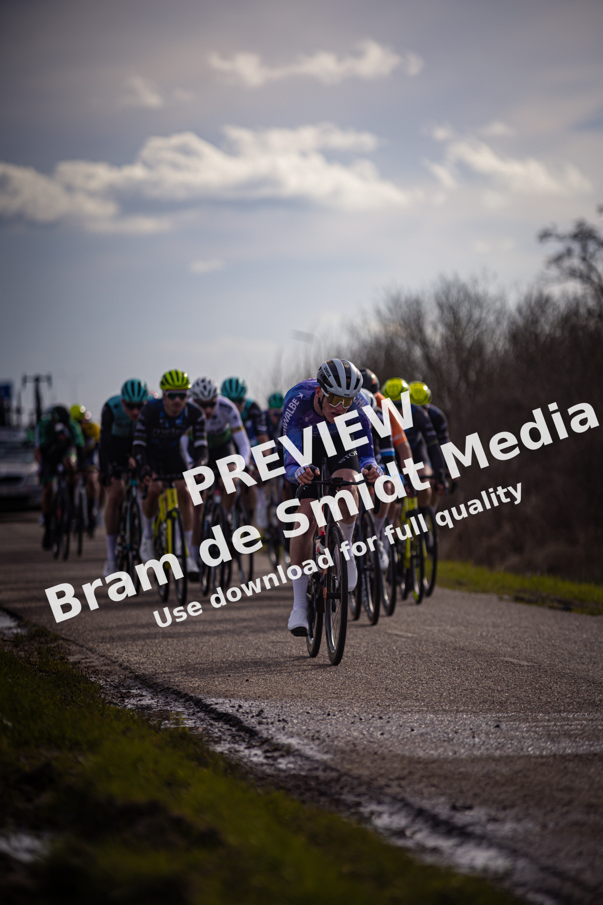 A group of cyclists race together in a Ster van Zwolle event.