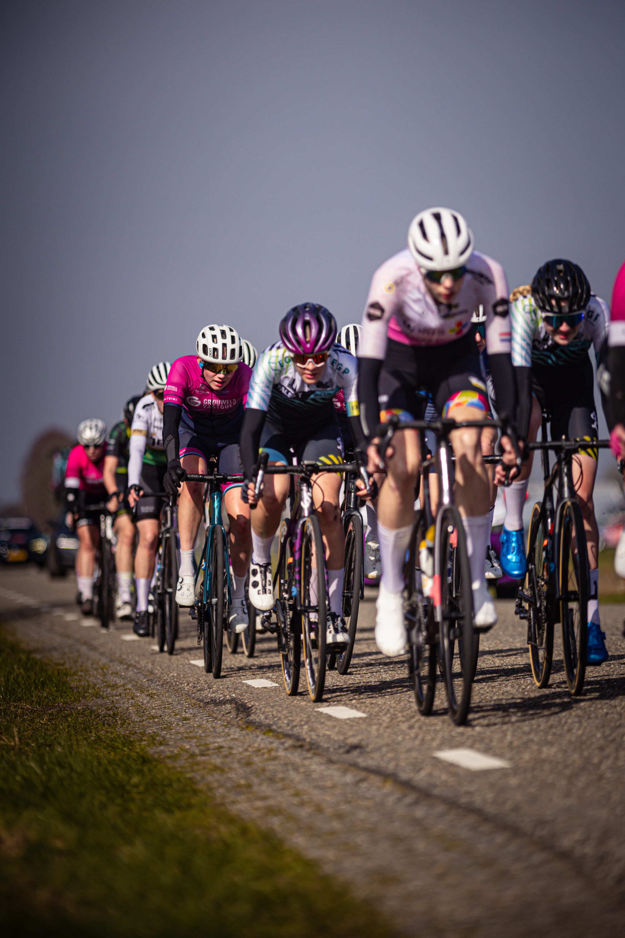 A group of women are racing on a bike race in the Netherlands.