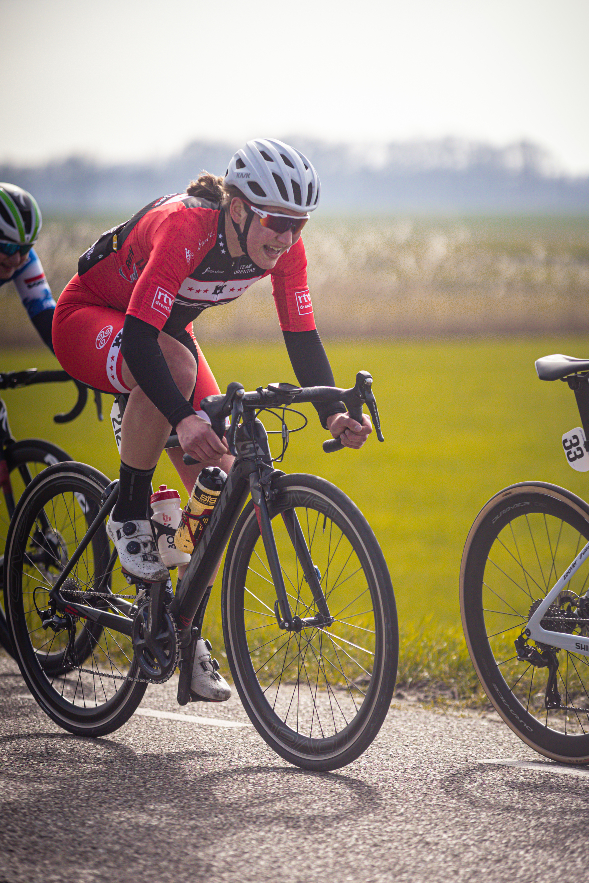 A woman on a racing bicycle at the Drentse 8 van Westerveld race.