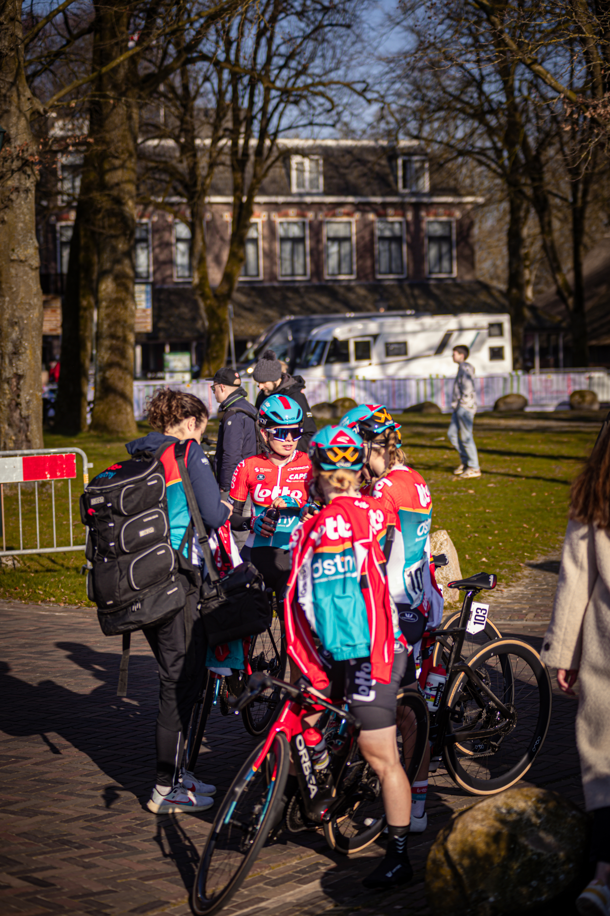 A group of cyclists preparing to race through the town.