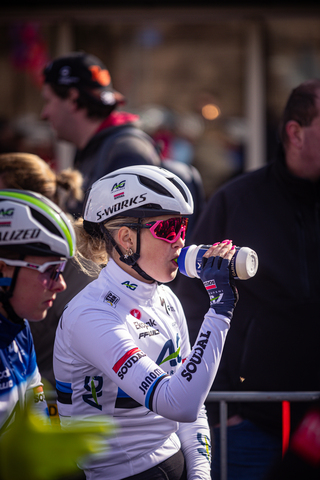 A woman athlete at a cycling race sponsored by Giant and Smit.