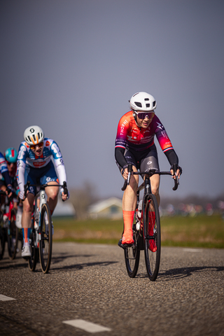 Three cyclists participating in the Drentse 8 van Westerveld race.