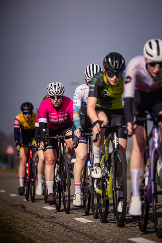 Bikers race down the road in a thrilling 2024 Wielrennen Drentse event.