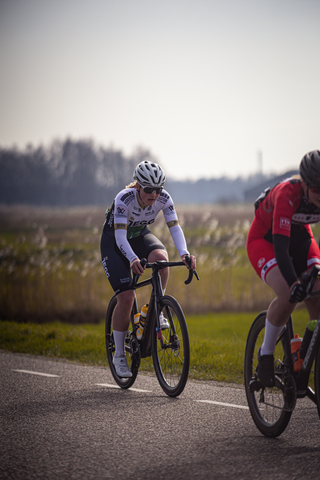 Two cyclists race down a road during the Drentse 8 van Westerveld in 2024.