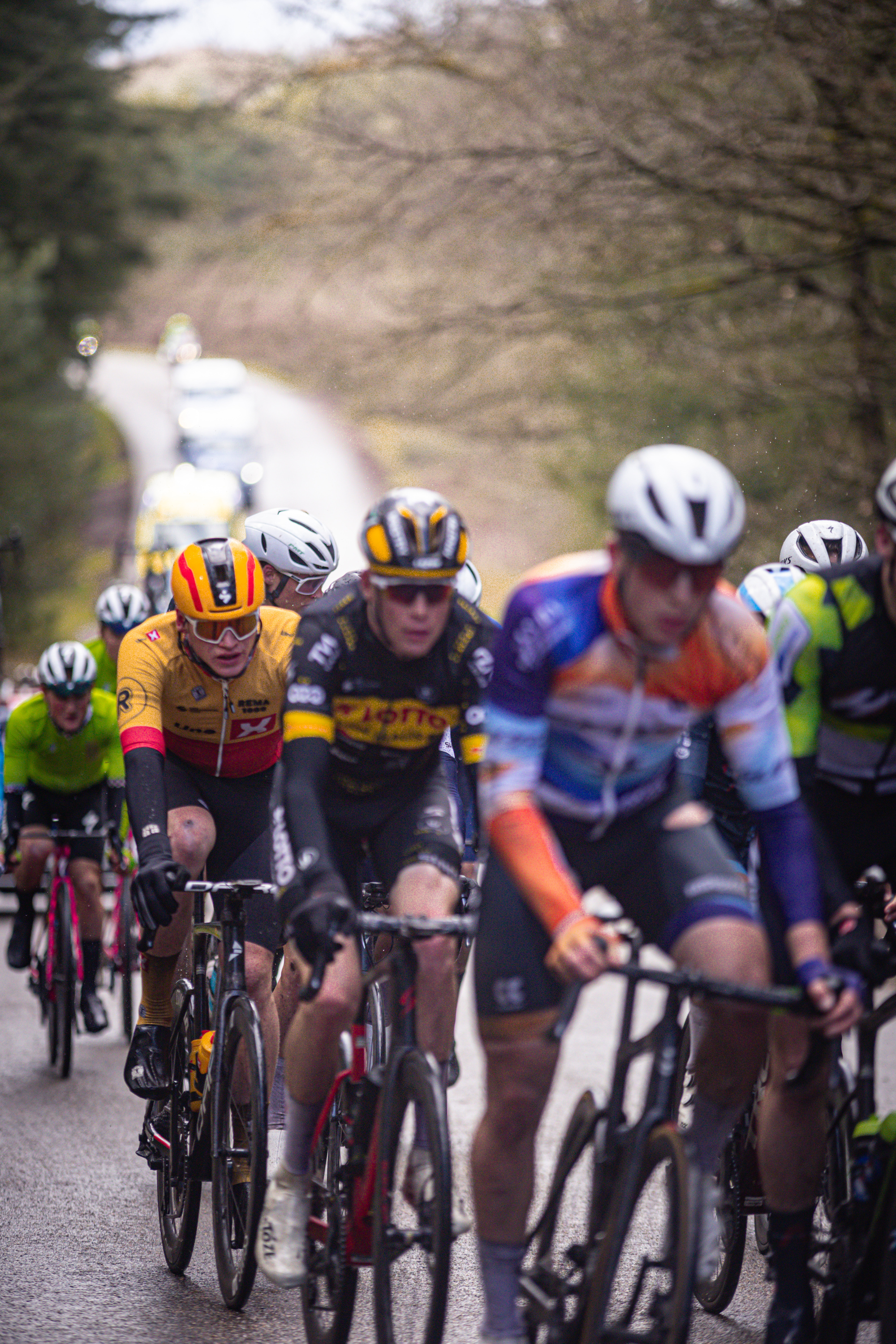 A group of cyclists on a road during the Olympias Tour.