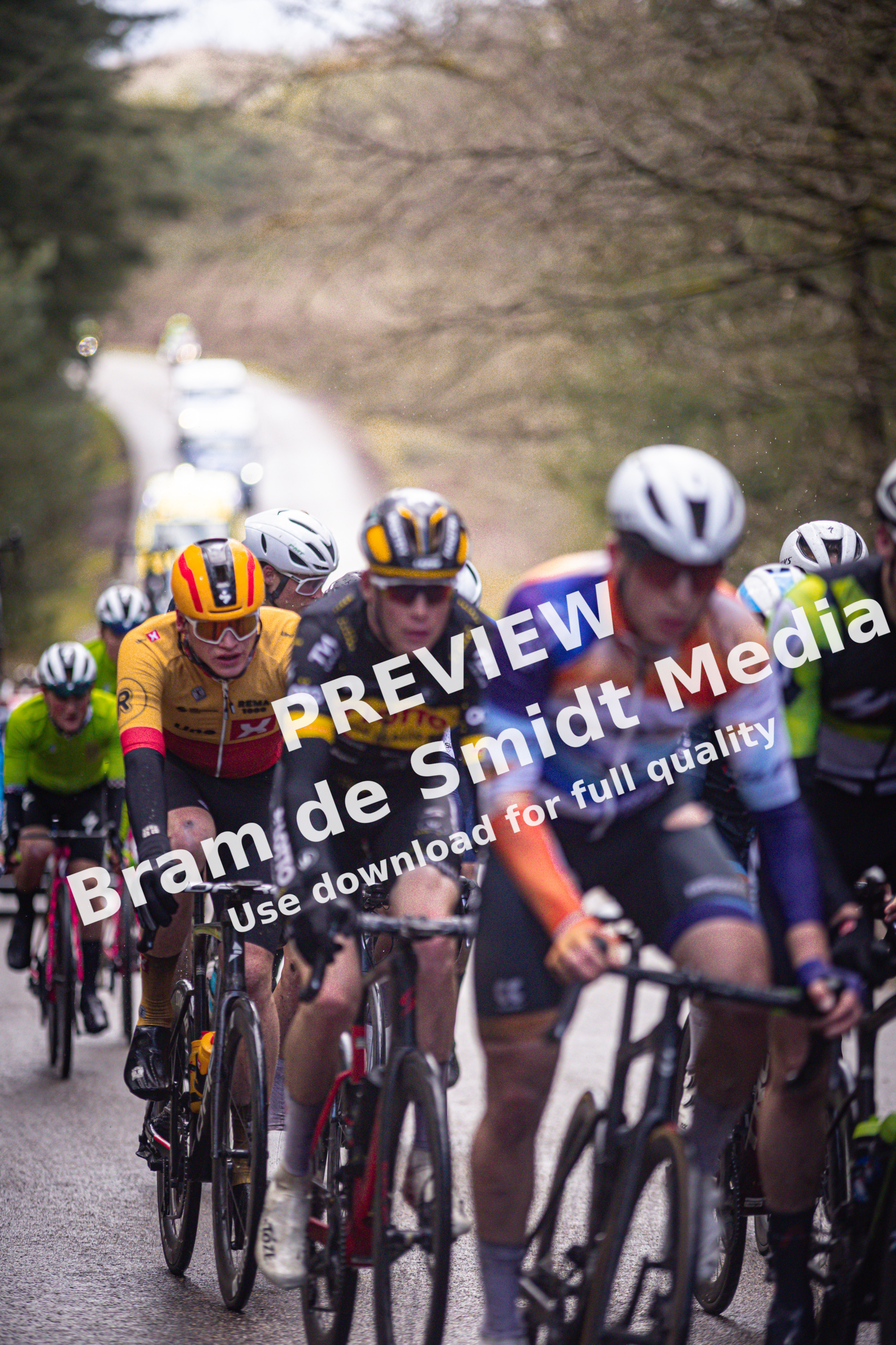 A group of cyclists on a road during the Olympias Tour.