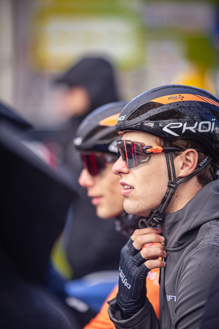 Two cyclists are wearing helmets that say "Grenen" on them.