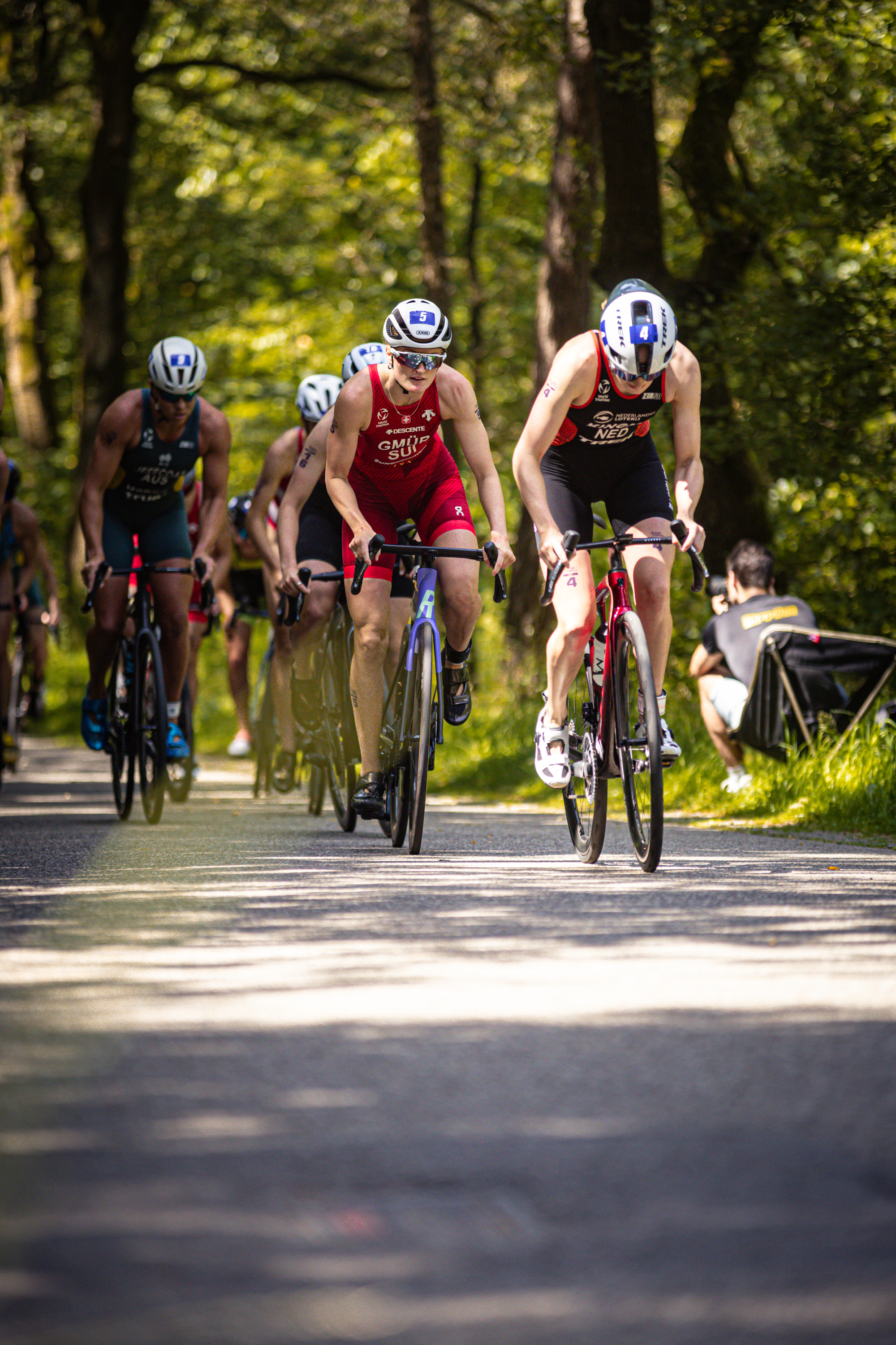 A group of cyclists participating in a triathlon race.