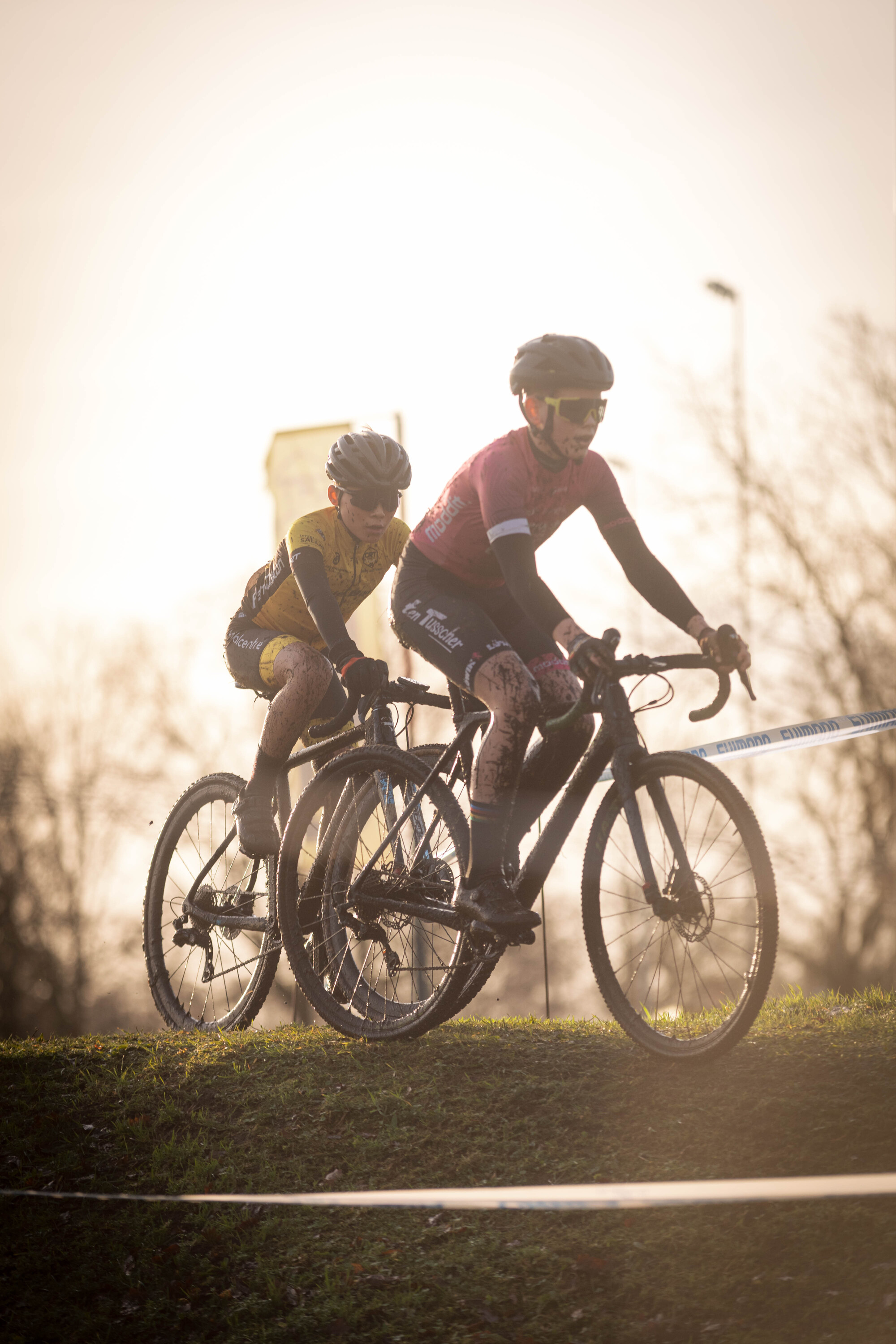 Two people on a cyclocross course in the Netherlands.