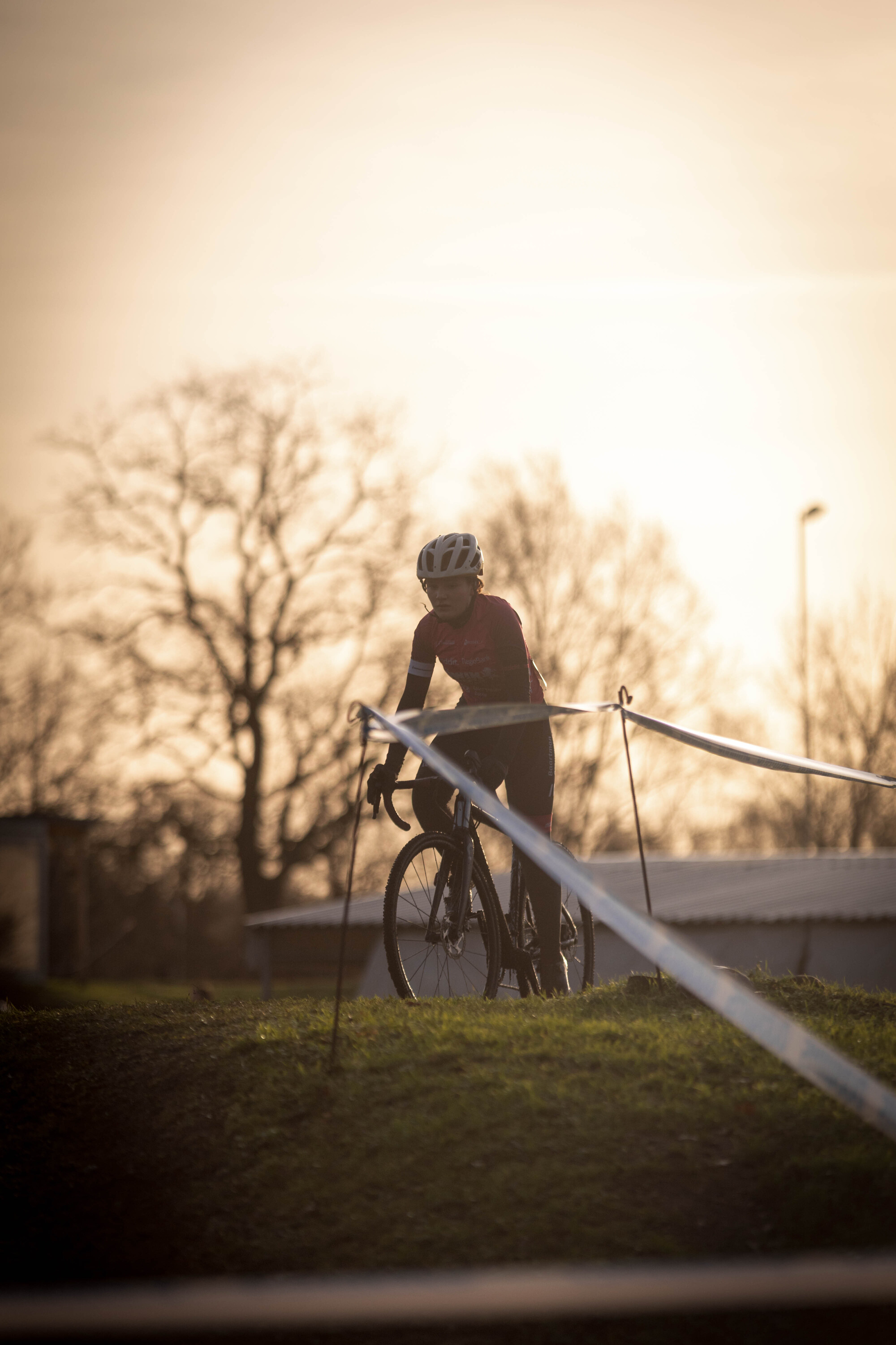 A young child is enjoying a cyclocross race in 2023.