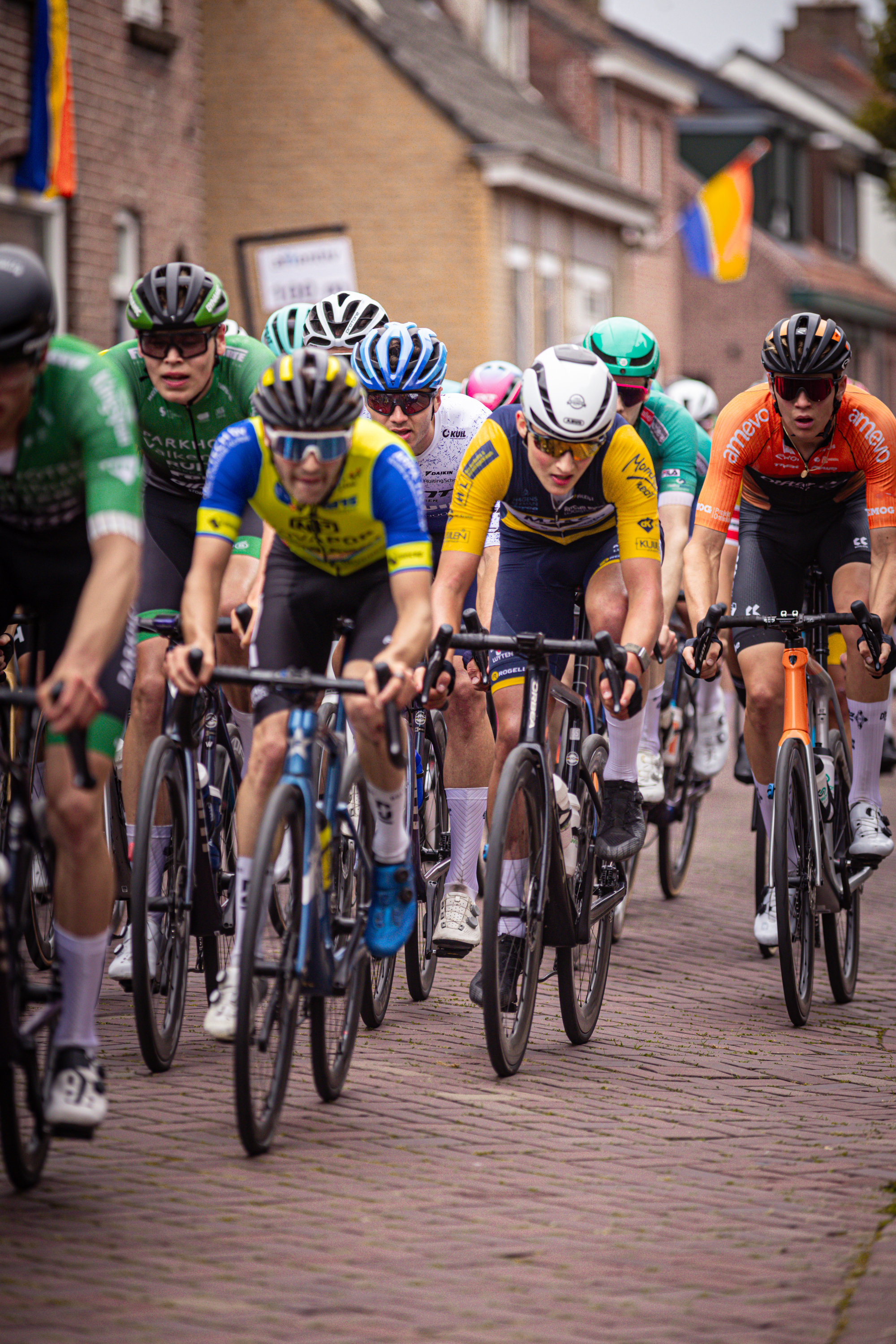 A group of cyclists compete in the Midden Brabant Poort Omloop race.