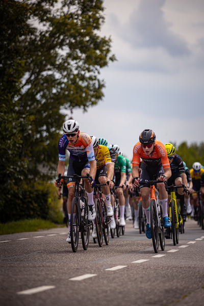 A group of cyclists racing in a race on Midden Brabant Poort Omloop.