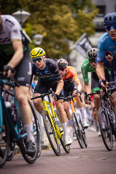 A bike race is taking place with multiple riders on bikes.