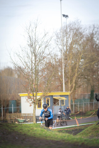 A group of people participating in a bicycle race.