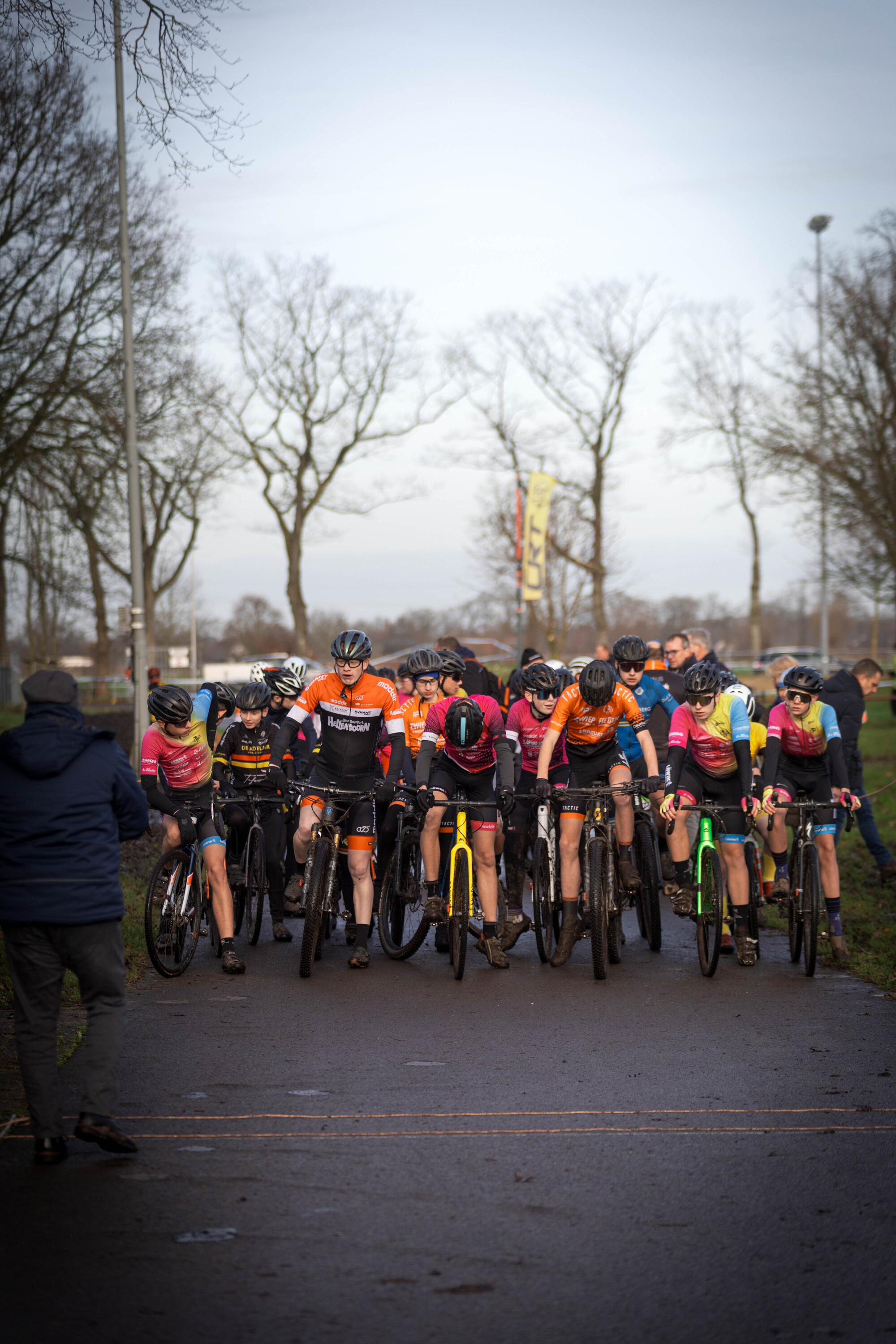 A group of cyclists are participating in a cyclocross race.