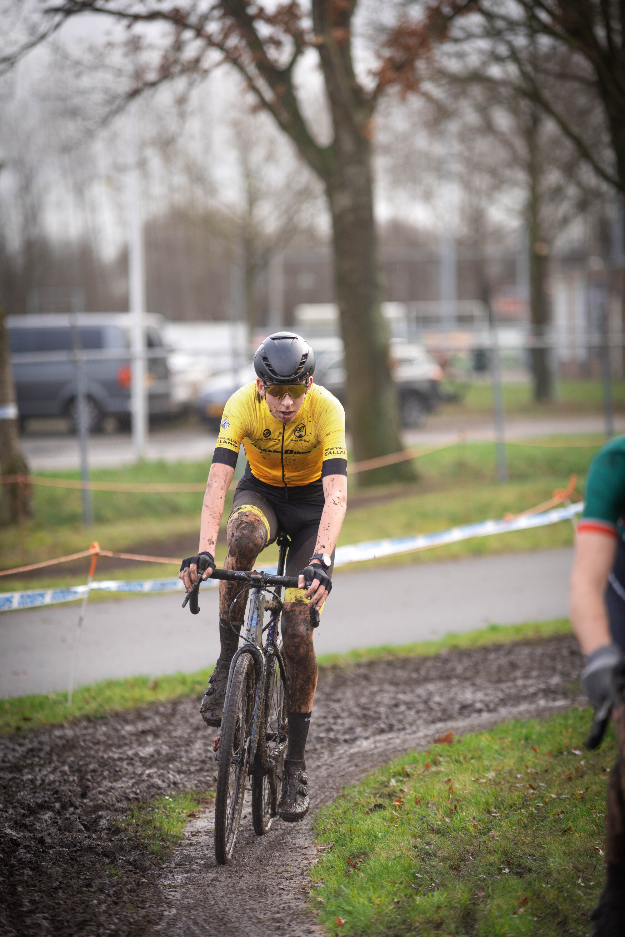 The cyclist is participating in a cyclocross race.