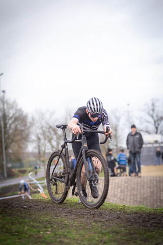 A man on a mountain bike with the number 18 on it.