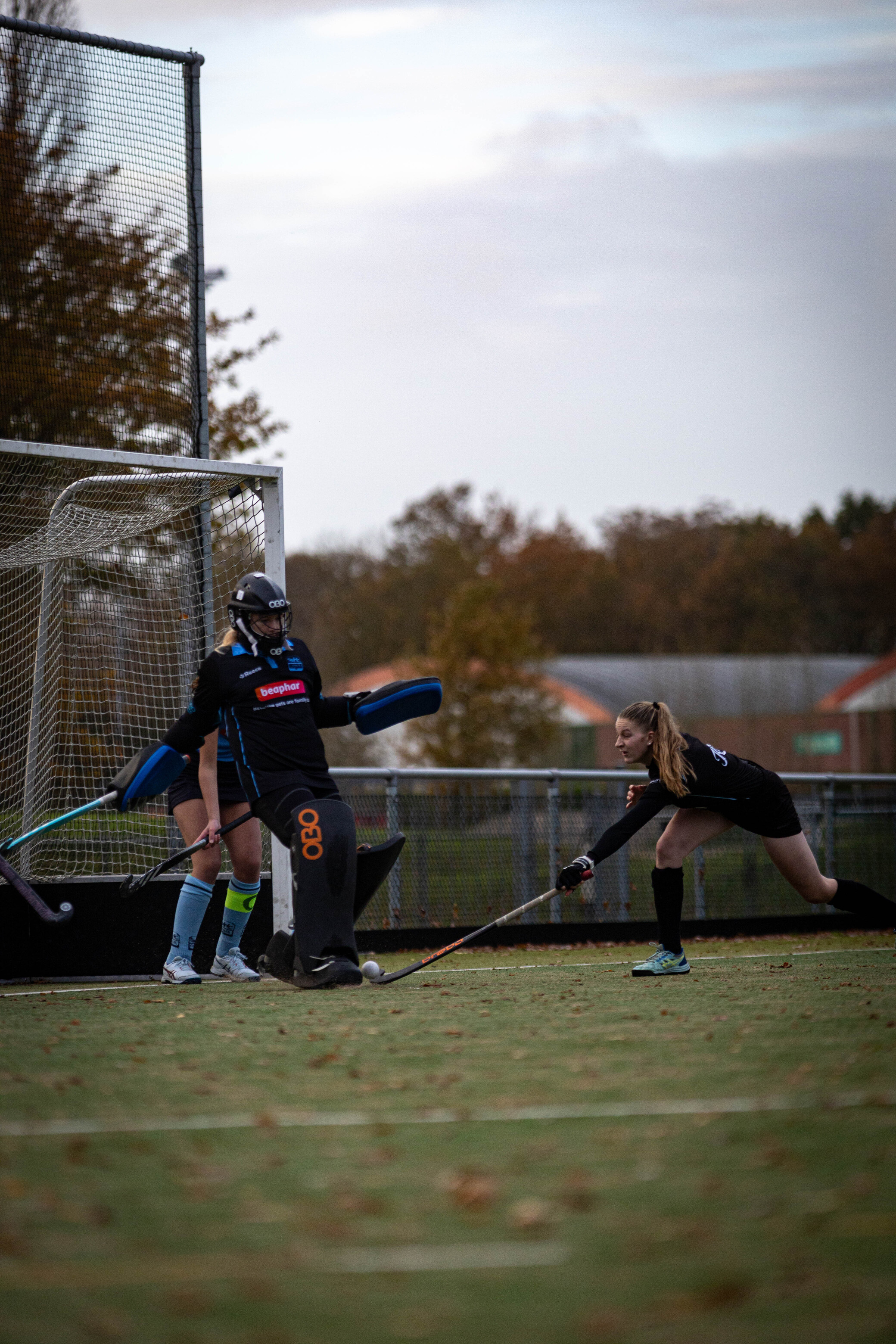 Two hockey players on a field with one player wearing number 8.