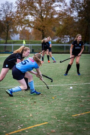 Four hockey players playing on a field with the numbers 9, 21 and 7.